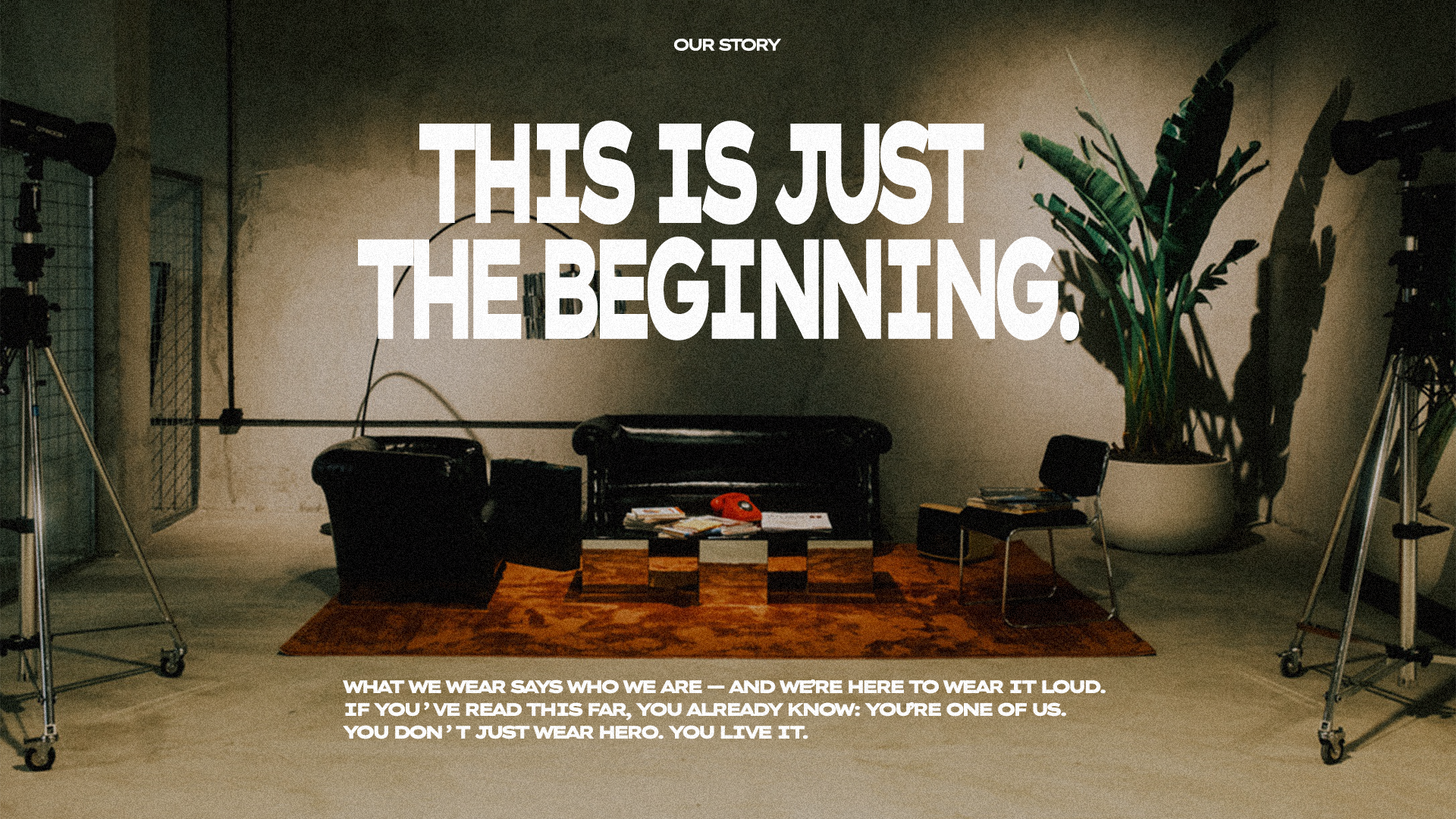 Set creativo con poltrone, riviste, cappellino HERO e scritta “This is just the beginning” — identità visiva del brand streetwear HERO.